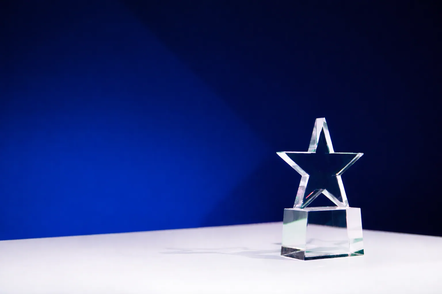 Crystal star award on blue
